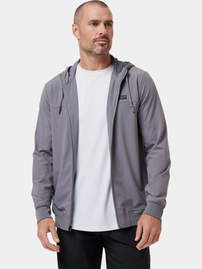 TravisMathew Strečová bunda WANDERLUST HOODIE šedá
